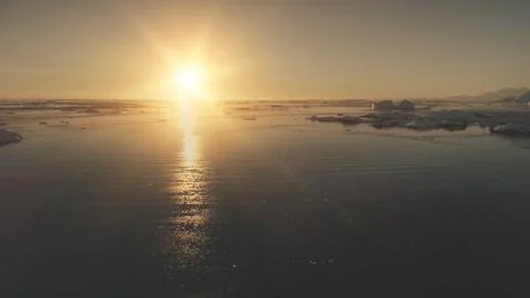 Flight over the ocean. Sunset light. Antarctica. 스톡 사진