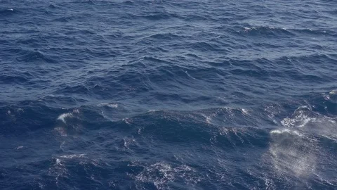 Flight over of ocean. Wave spray, medium shot Video stock 76538192