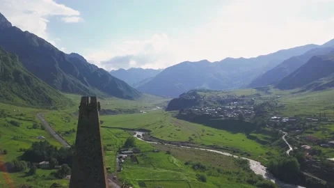 Flight Over The Old Brick Tower And Mountain Village. Georgia. 4K. Stock Footage 150543998