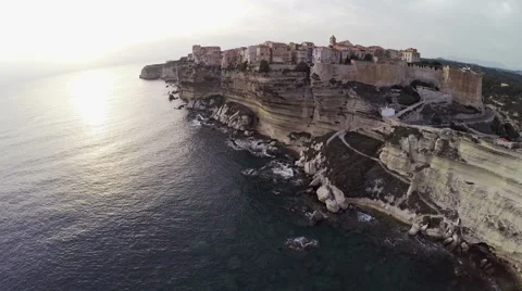 Flight over old city Bonifacio and area at sunset colors. Corsica, Aerial view. Video stock 47395032