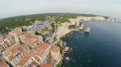 Flight over old city Bonifacio and area at sunset. Corsica, aerial view. Video stock 47415351