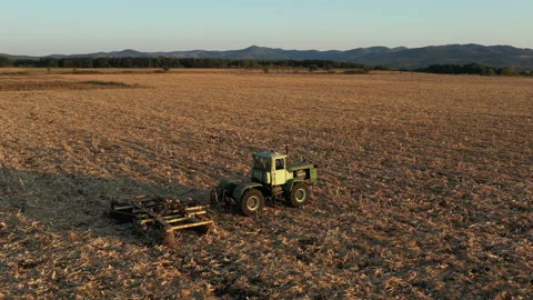 Flight Over Old Farm Machine in the Sunset 2 Stock Footage 137309418