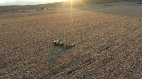 Flight Over Old Farm Machine in the Sunset 1 Video stock 137309683