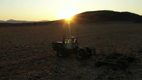 Flight Over Old Farm Machine in the Sunset 7 Stock Footage 137310138