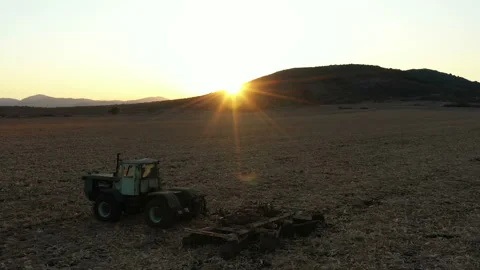 Flight Over Old Farm Machine in the Sunset 9 Stock Footage 137310254