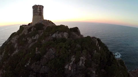 Flight over old tower in the sea at sunset. Corsica, France. Aerial view. 動画素材 47476727