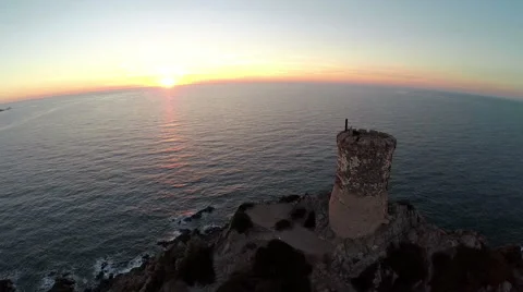 Flight over old tower at sunset. Corsica, France. Aerial view. Video stock 47481039