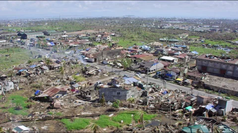 Flight over the outskirts of a destroyed town after typhoon Haiyan Video stock 33871594