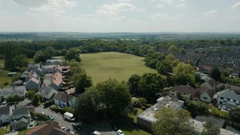 Flight over over an affluent living area big houses wide roads fields Stock Footage 296821686