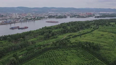 Flight over the park with a view of the barges and the city Stock Footage 170884809