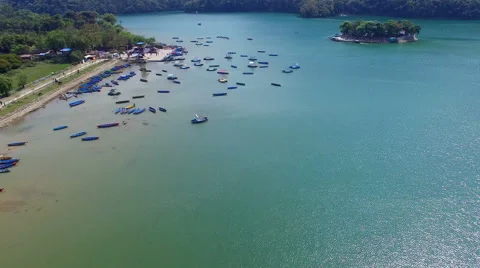 Flight over Phewa lake water Pokhara Nepal time-lapse 4k video. Boat station Stock Footage 64825670