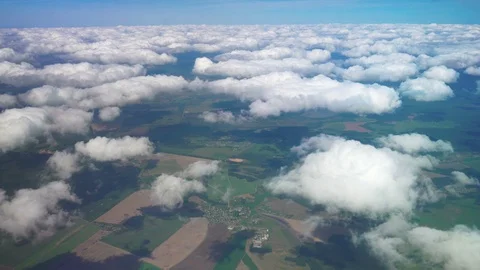 Flight over the picturesque clouds and green earth. Stock Footage 122101663