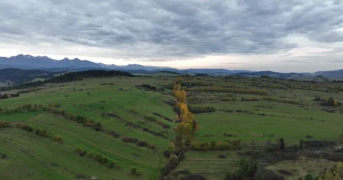 Flight over Pieniny autumn meadows toward the Tatra Mountains Stock Footage 346644589