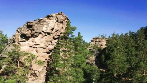 Flight over the pine forest in the rock. Beautiful blue mountain lake panorama Stock Footage 142247229