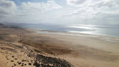 Flight over Playa de la Barca beach, Fuerteventura Stock Footage 232379533