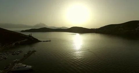 Flight over a pool at sunset and the sea. Ios island, Greece Stock Footage 70876076