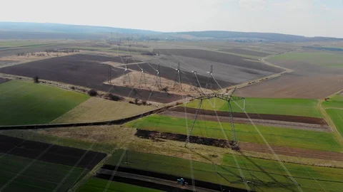 Flight over power lines. High voltage transmission lines of thousands of Stock Footage 128038554