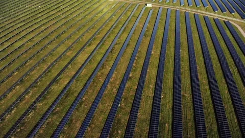 Flight over power plant using renewable solar energy with sun Stock Footage 135380714