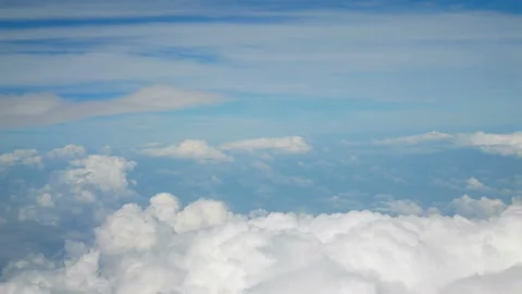 Flight over puffy fluffy white clouds blue sky. cloudscape background Stock-Footage 135229806