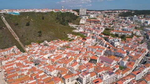 Flight over Red Tiled Roofs City of Nazare Stock Footage 89886567