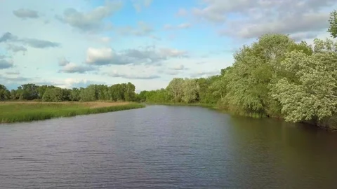 Flight over river and forest in spring Stock Footage 131729135