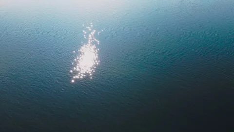 Flight over the river and glare of the sun on the water Stock Footage 128617390