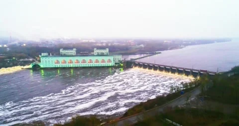 Flight over the river and hydro station near the city Video stock 169442453