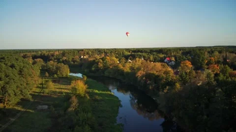 Flight over the river in the background with Hot air balloon Stock Footage 163015408