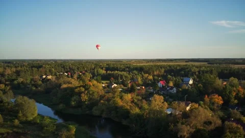 Flight over the river in the background with Hot air balloon Stock Footage 163015881