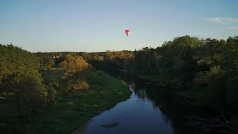 Flight over the river in the background with Hot air balloon Stock Footage 163015958