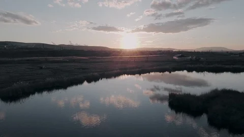 Flight over the river during sunrise Video stock 128616955