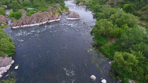 Flight over  river with forest and rocks Stock Footage 82739521