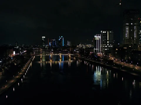 A flight over the river in Frankfurt in a spring night, skyline, aerial. Video stock 80190900