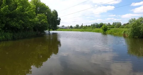 Flight over the river, low over the water, two banks of the river Stock Footage 90076156