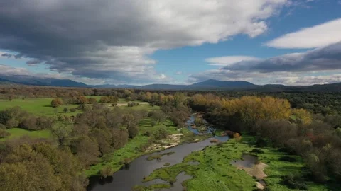 Flight over river with mountains background 스톡 동영상 245376807