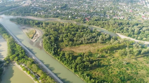 Flight over the river near the settlemen Stock Footage 153475666