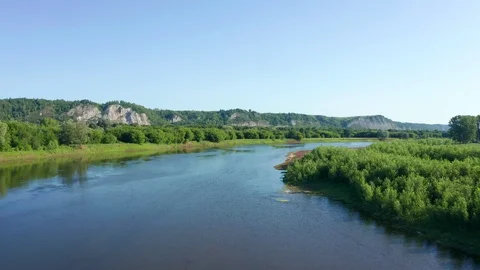 Flight over the river with a smooth rise over the valley Stock Footage 119074878