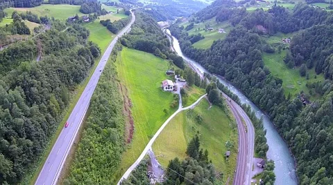Flight over a river valley in the alps Stock Footage 41657566