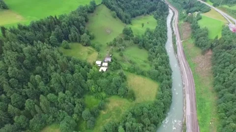 Flight over a river valley in the alps, aerial view from the mountain Stock Footage 57661465
