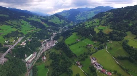 Flight over a river valley in the alps, aerial view from the mountain Stock Footage 57661542
