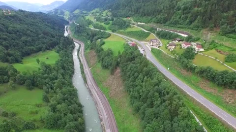 Flight over a river valley in the alps, aerial view from the mountain Stock Footage 57661642