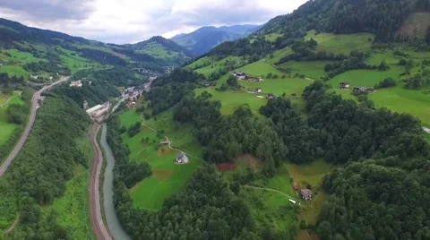 Flight over a river valley in the alps Stock Footage 57661764
