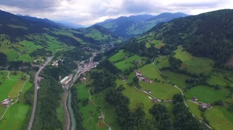 Flight over a river valley in the alps, aerial view from the mountain Stock Footage 57661795