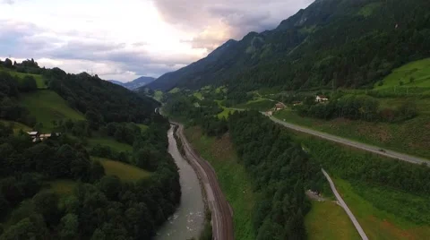 Flight over a river valley in the alps, aerial view from the mountain Stock Footage 57662121