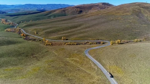 Flight over the road between fields. 스톡 동영상 123519708