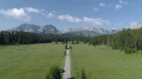 Flight over the road going to high rocky mountains. Durmitor National Park 스톡 동영상 84388622