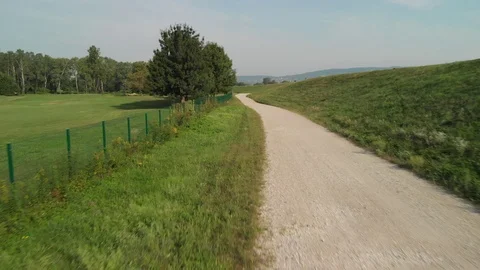 Flight over road by the golf course Stock Footage 115725607
