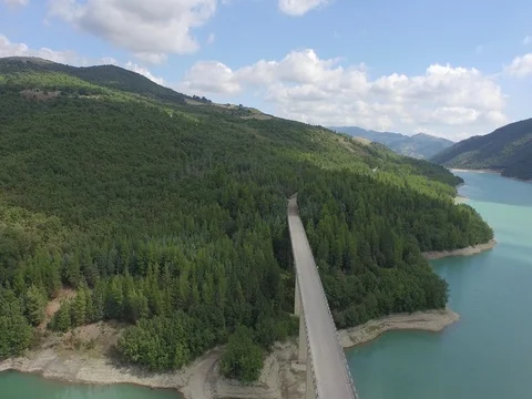 Flight over the road on the lake Stock Footage 72165175