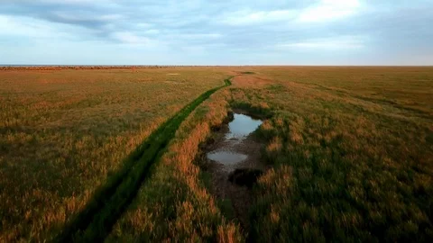 Flight over the road in the steppe Stock Footage 120138591