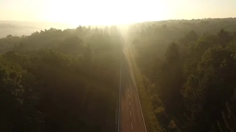 Flight over the road at sunrise. Video stock 80789684